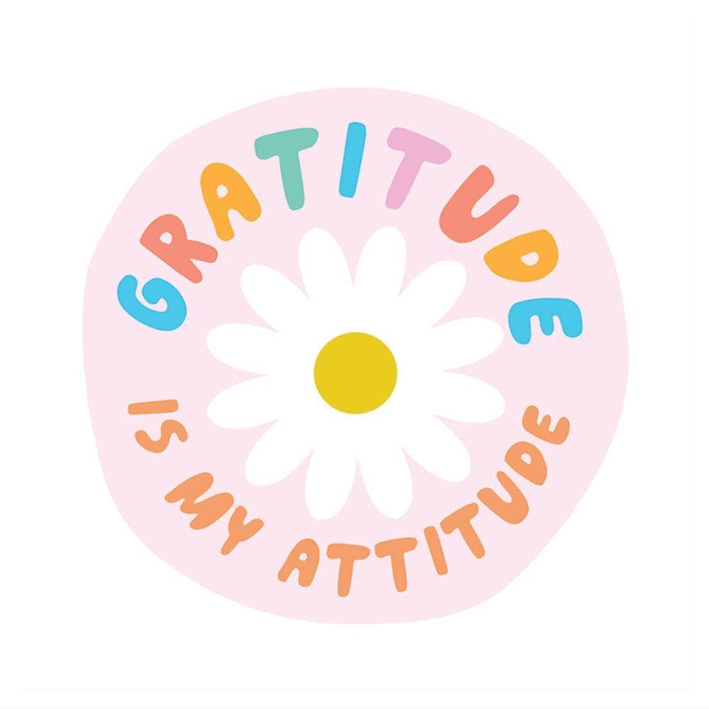 A unique vinyl sticker featuring a flower with a yellow center, embodying the message Gratitude Is My Attitude. Perfect for sticker enthusiasts seeking exclusive designs.