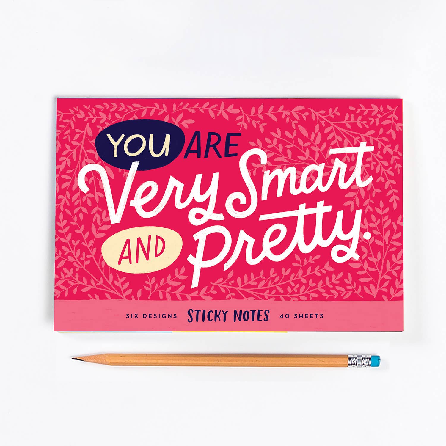 Pink and white notepad with pencil, featuring You Are Very Smart and Pretty design. Six 2.75 x 2.75-inch pads with 40 sheets each.