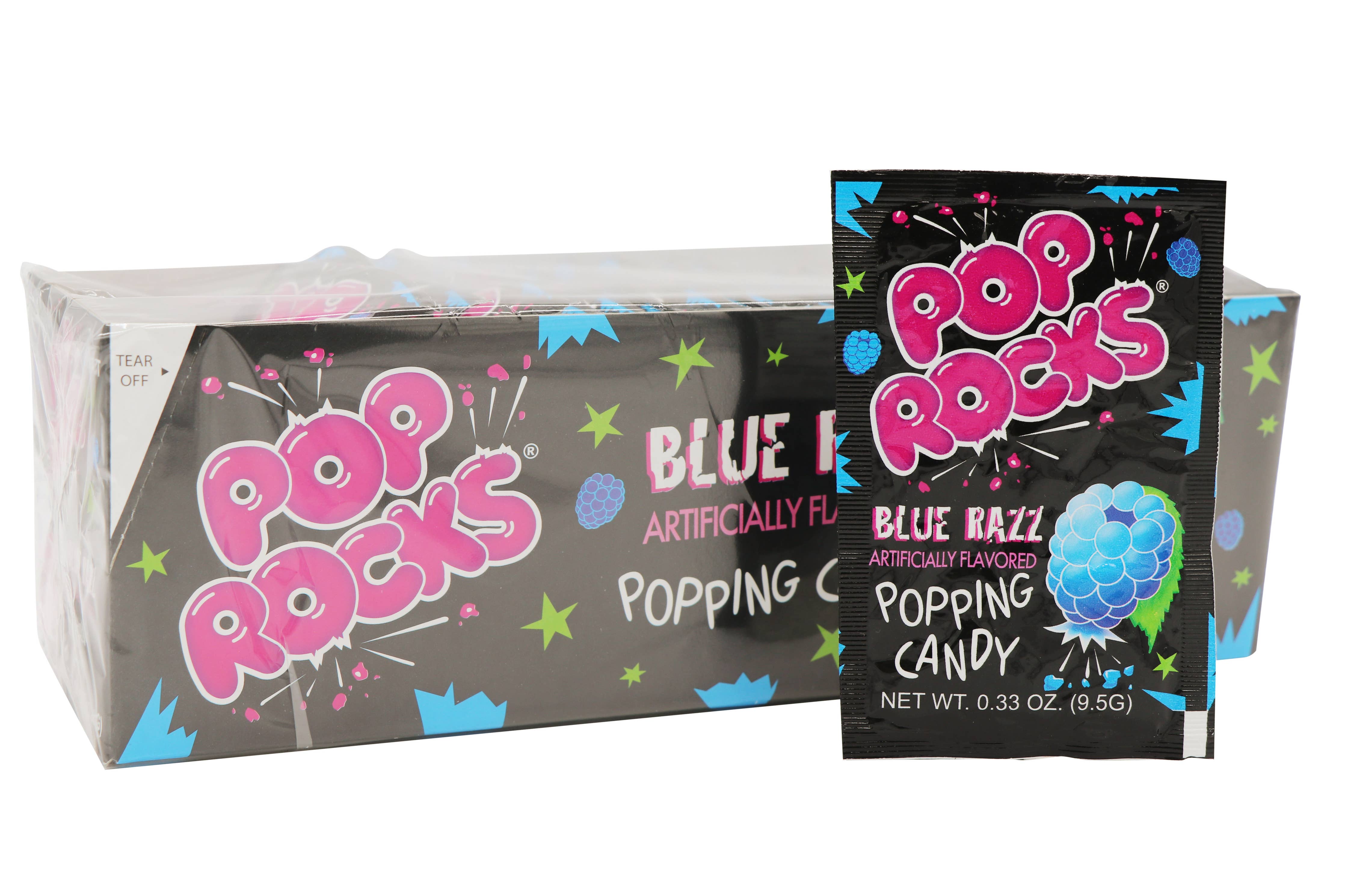 A pack and a single packet of nostalgic Pop Rocks candy from Grandpa Joe's Candy Shop. The packaging is primarily black with colorful, dynamic text and graphics. The pack's text reads "Pop Rocks" and "Blue Razz Artificially Flavored Popping Candy". The single packet of candy crystals is displayed in front of the larger pack, which is available as Pop Rocks, Blue Razz, 0.33oz, 24Ct Case.