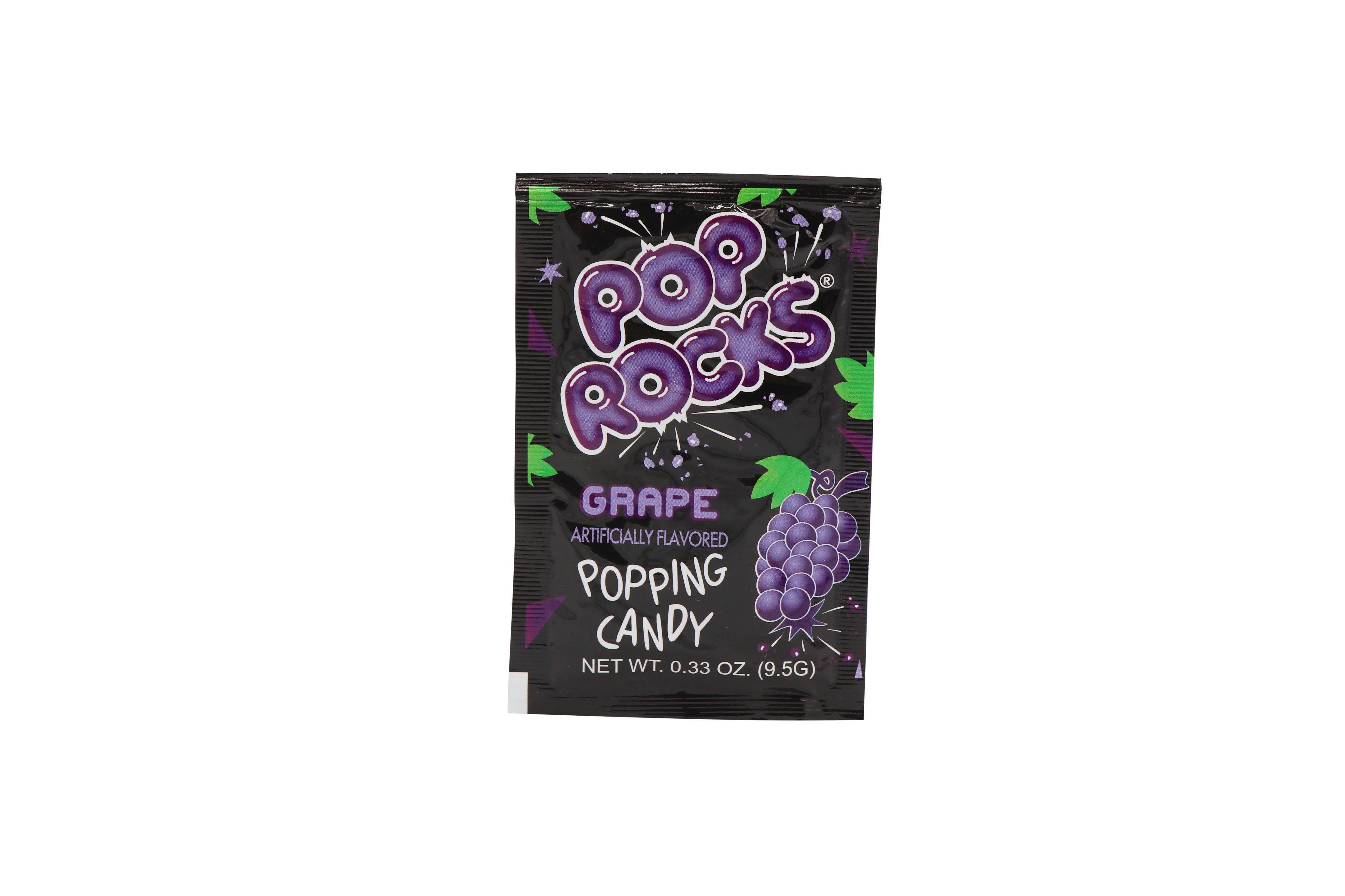 Pop Rocks Grape candy package featuring purple and white design, 0.33oz, 24Ct Case. Nostalgic candy with gas-filled crystals for a popping sensation. Ideal for treat bags and themed parties.
