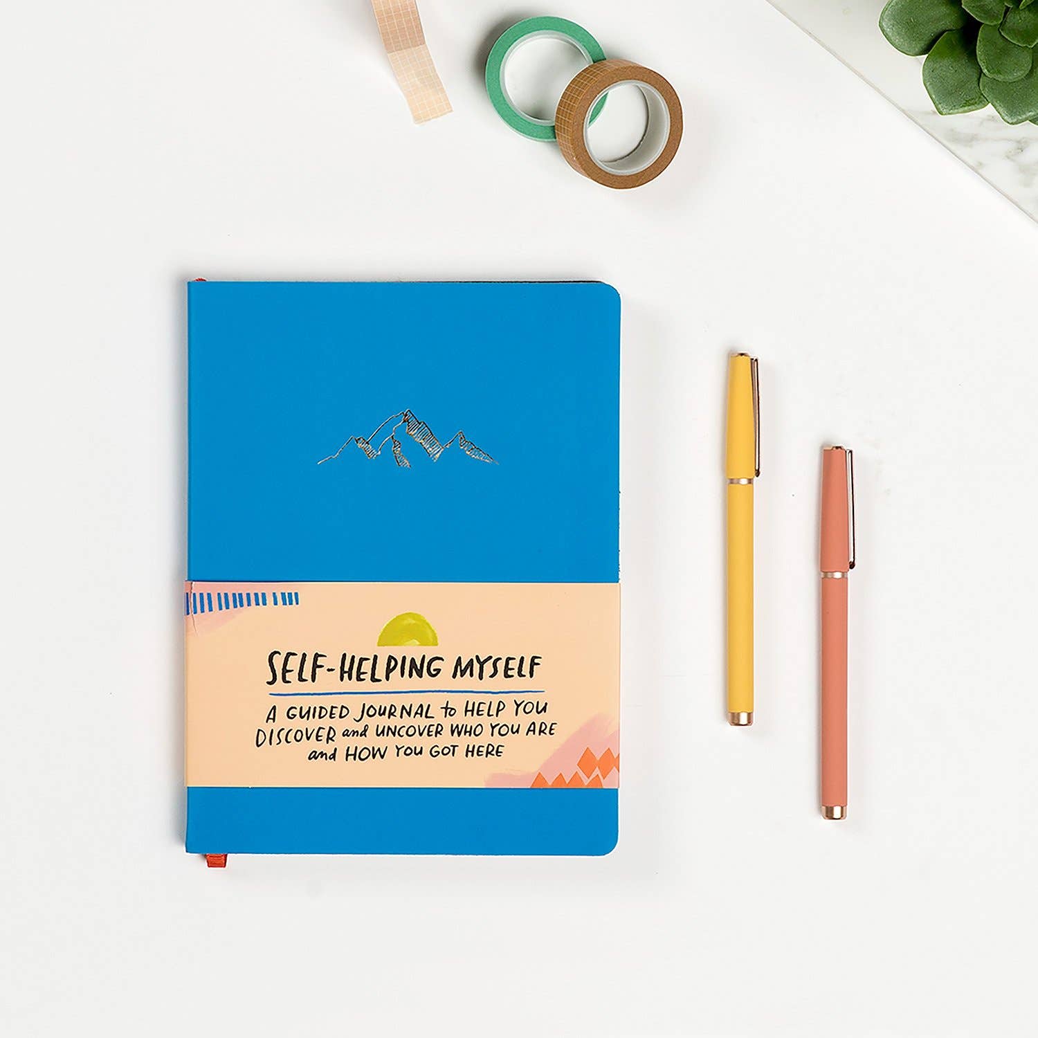 A guided journal titled Self-Helping Myself with prompts, illustrations, and a faux leather cover. Features thoughtful content for self-reflection and positive changes.