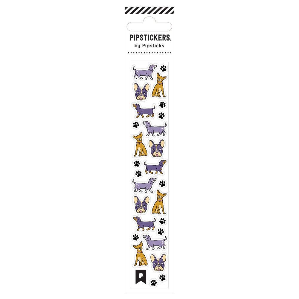 A sticker sheet featuring charming cartoon dogs, including a purple dog with unique designs. Product title: Good Doggie Minis. Ideal for sticker enthusiasts, with silver foil accents on clear backing.