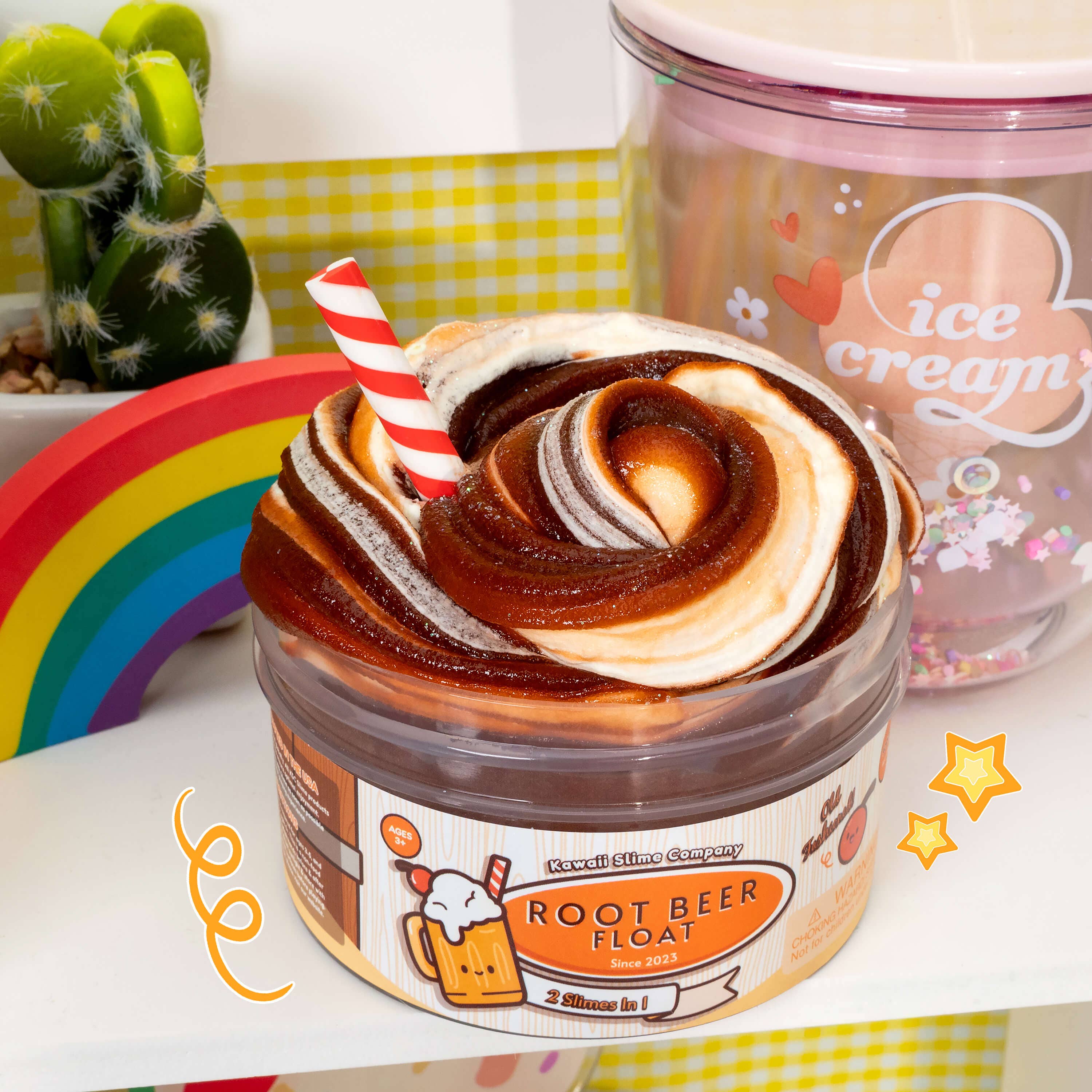 A glossy slime container with a straw, topped with ice cream scoop clay, embodying the Root Beer Float 2 Slimes In 1 product experience.