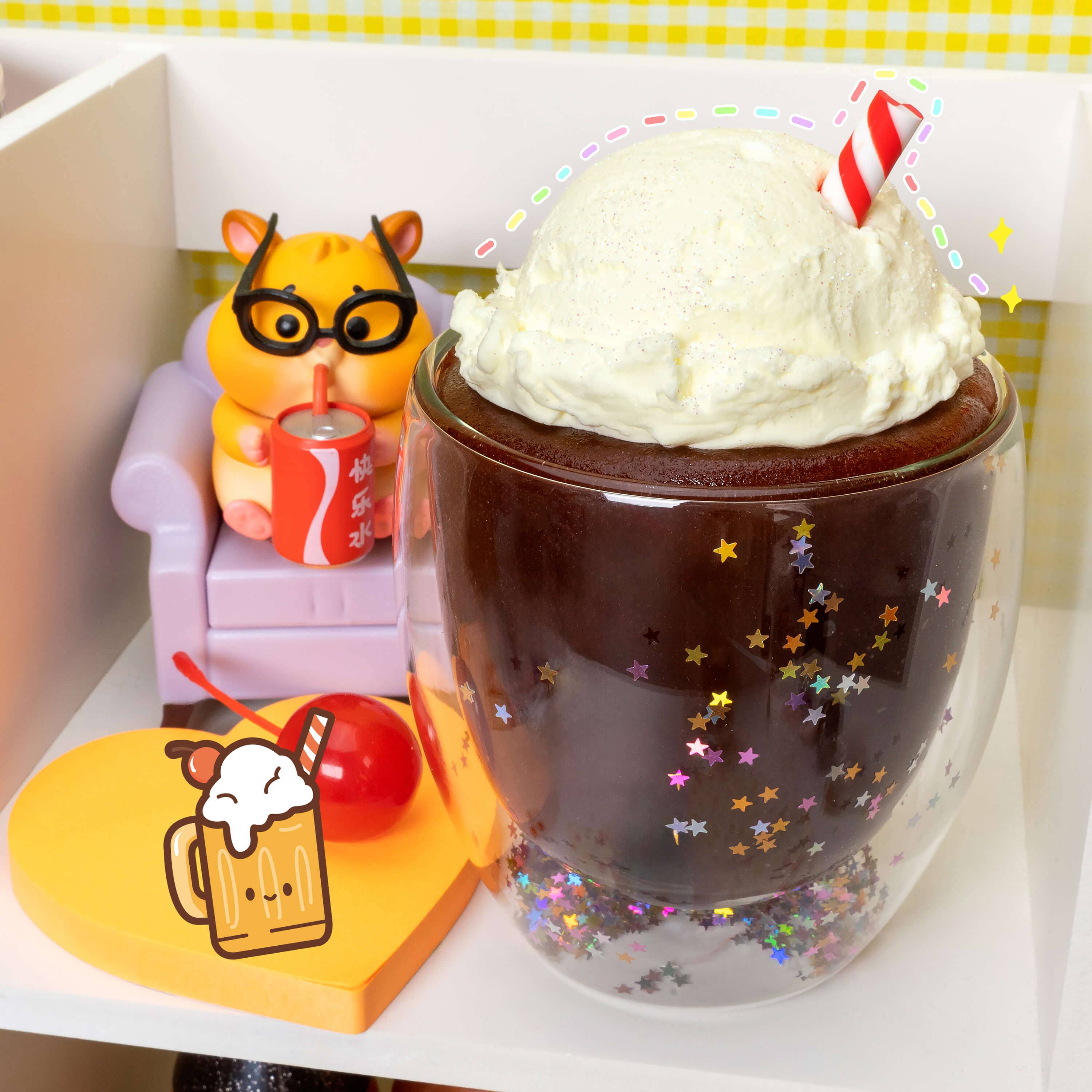 A glass cup with a straw, chocolate drink, whipped cream, and toy animal, showcasing Root Beer Float 2 Slimes In 1 product.