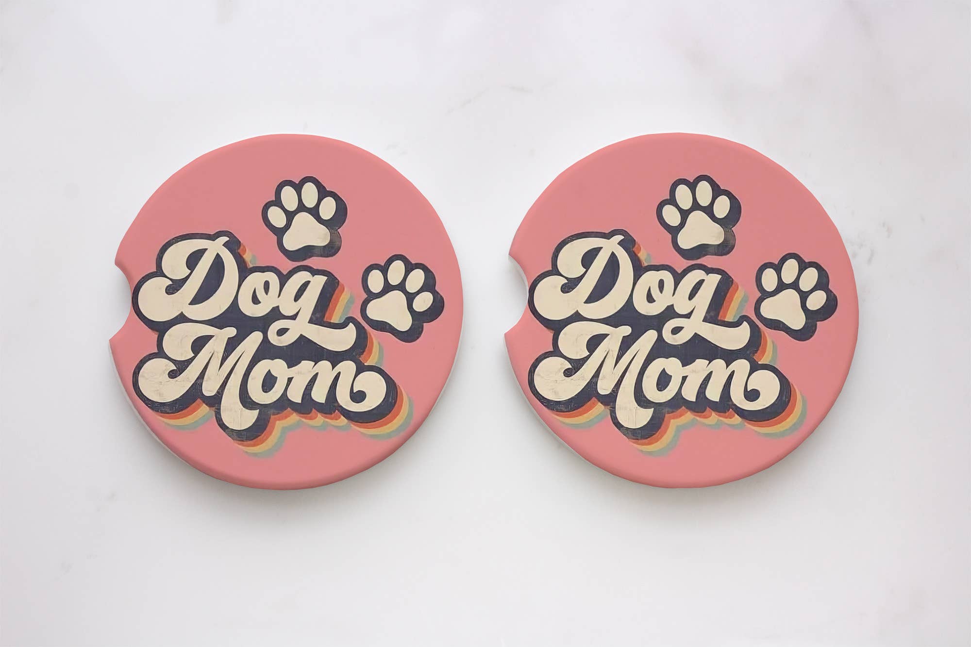Neoprene car coasters featuring paw prints and text, absorbent and durable. Set of 2 with cloth top and rubber backing. Ideal for Dog Moms on the go.
