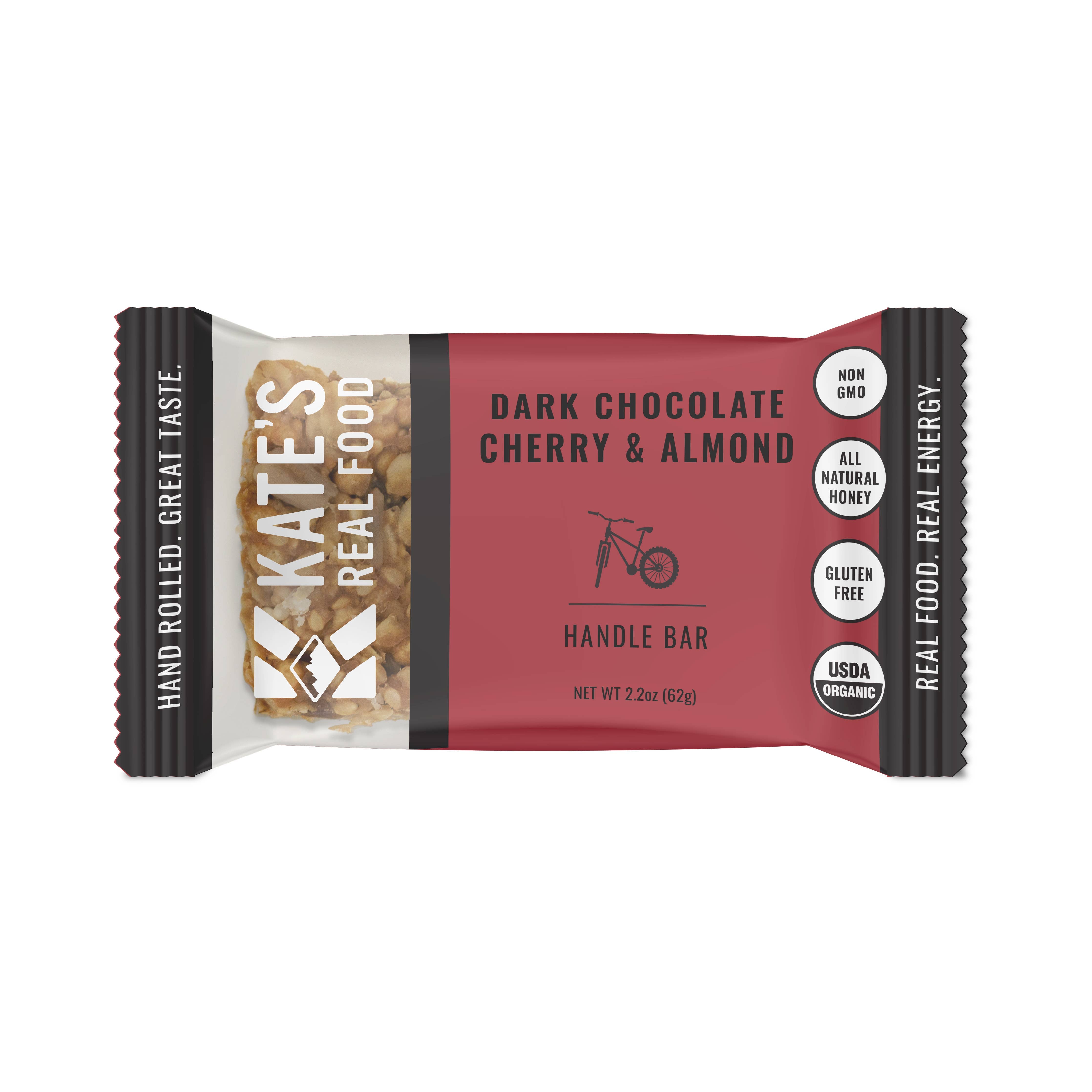 Organic Kate's Real Food Handle Chocolate Cherry Almond Bar. Close-up of a wholesome snack with dark chocolate, cherries, and almond butter. Gluten-free, non-GMO, USDA-certified. Ideal for adventures.