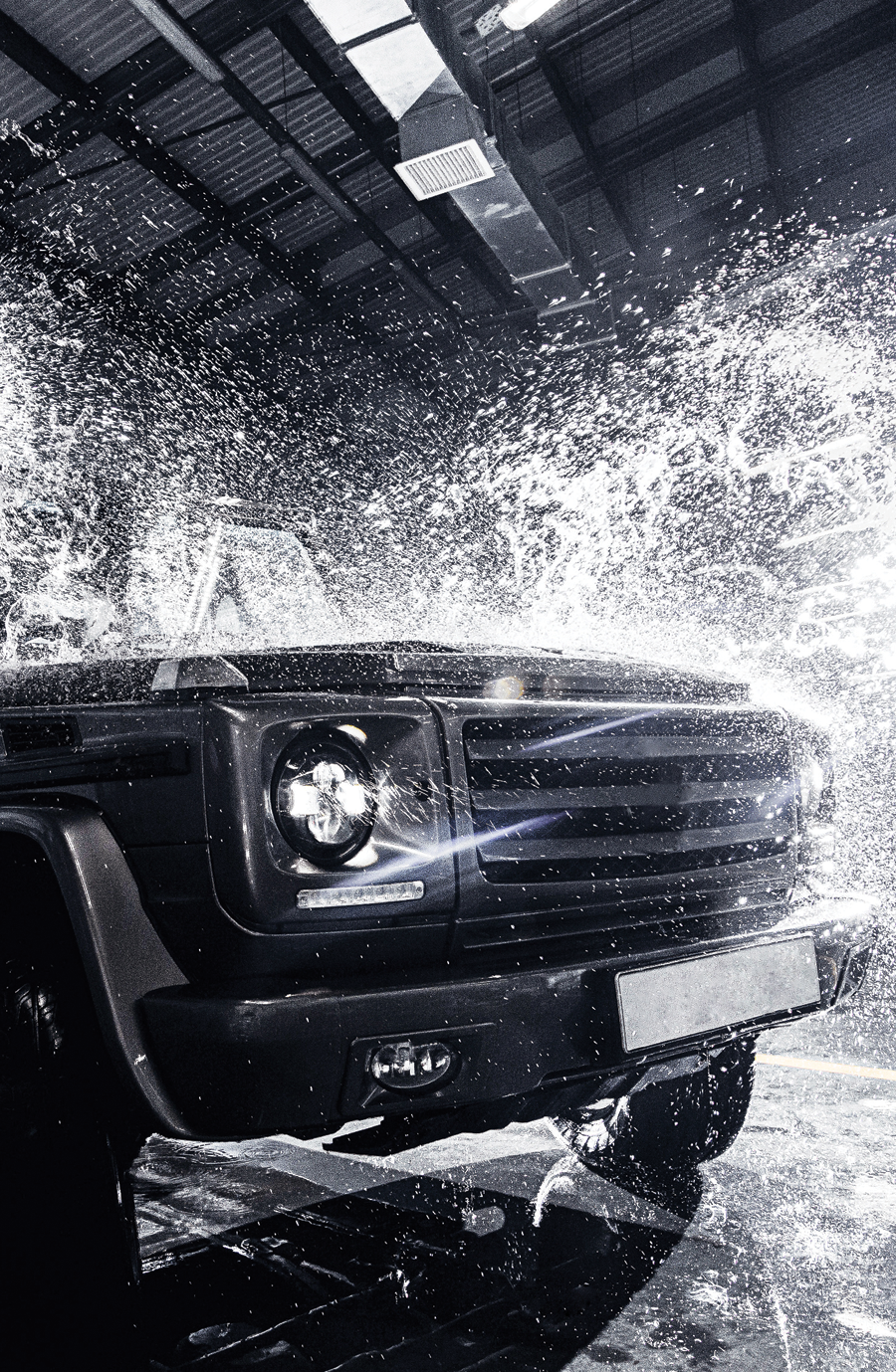 A car with water splashing out, showcasing a comprehensive 5 Day Weather Guarantee package: leather and vinyl treatment, interior sterilization, ceramic paint booster, gloss tire shine, and more.