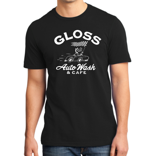 A man in a black shirt featuring a black and white logo. The shirt is the Gloss Wolf T-shirt with a car and cat design.