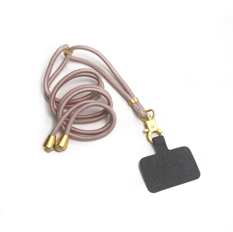 A black tag with a gold cord, a lanyard, and a black tag close-up. The Hookup Phone Lanyard: Rose Gold. Durable metal hardware, adjustable strap, hands-free phone solution.