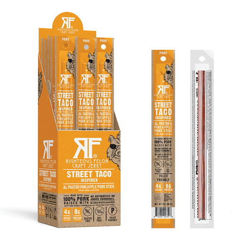 A package of Street Taco Pork Stick - 24 Pack, featuring a pork stick seasoned with taco flavors and pineapple. Inspired by Al Pastor tacos, this gluten-free, Paleo-friendly snack is a tribute to Mexico City's culinary scene.