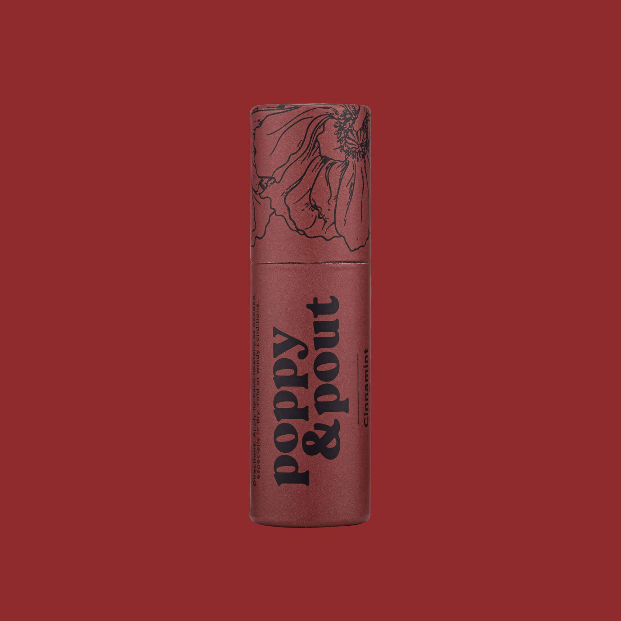 Cinnamint Lip Balm tube with logo, red container, and flower detail. Handmade with 100% natural ingredients, double-sized, cruelty-free. Ideal for cinnamon lovers.