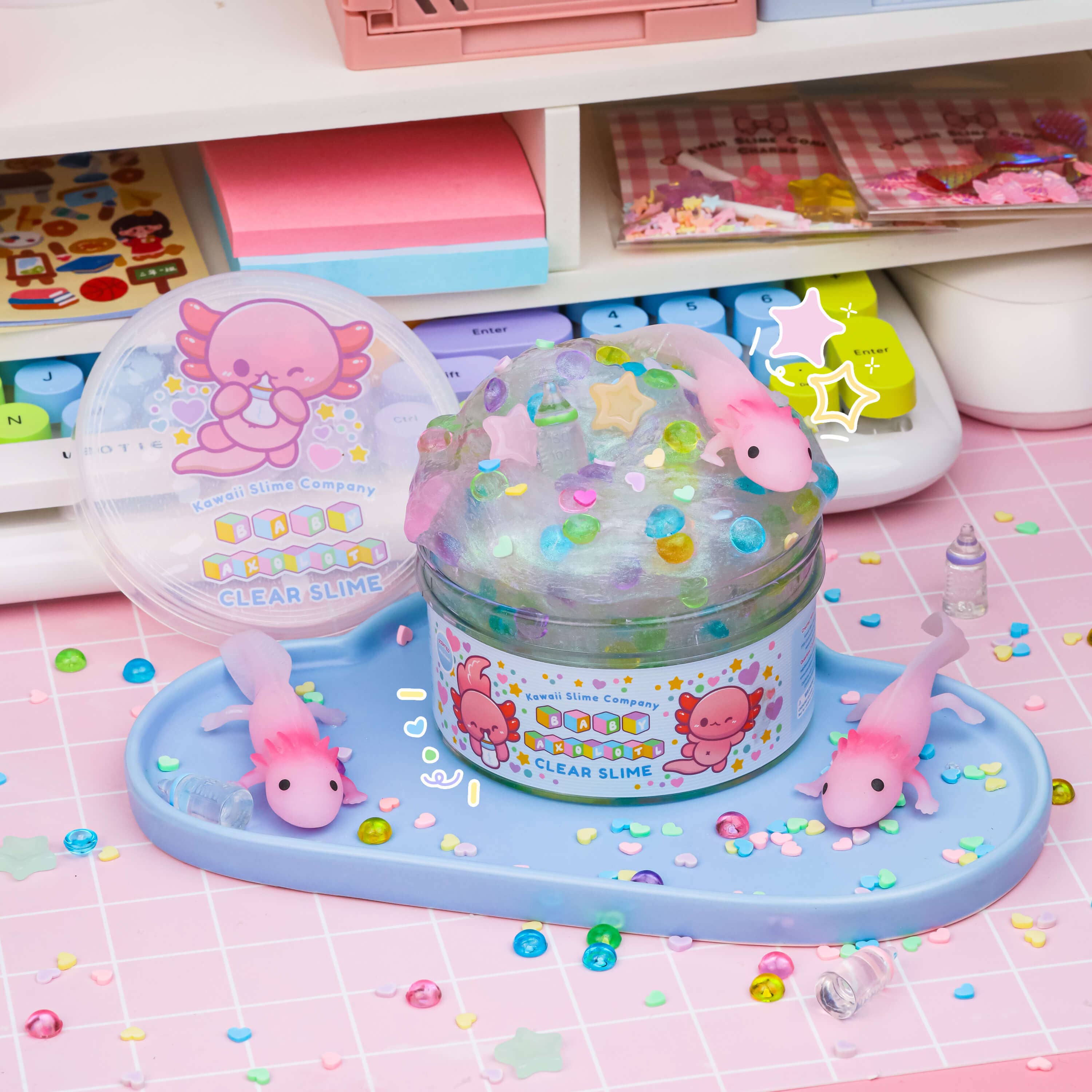 A clear slime set featuring Baby Axolotl figures, creating oohs and aaahs with ease. Your underwater pet that stays put, offering endless slime bliss.