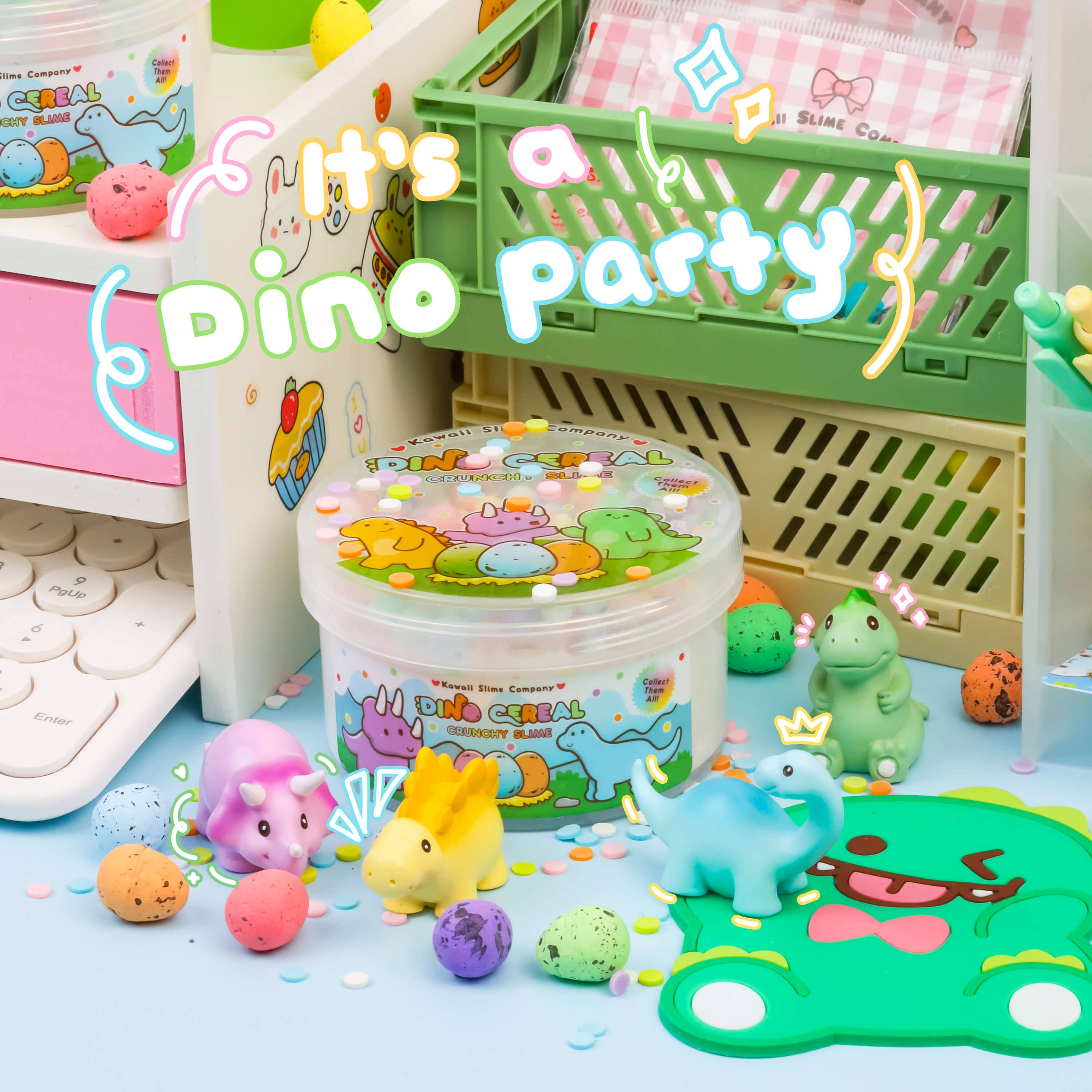 A group of baby toys featuring Dino Cereal Crunchy Slime. Includes glossy slime, pastel foam beads, dino eggs, confetti sprinkles, and collectible dinosaur miniatures.