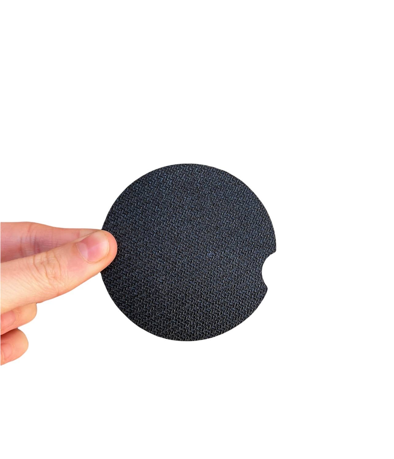 A hand holding a black circle, close-up of a finger. Set of 2 Black Checkered Car Coasters, absorbent neoprene with cloth top and rubber backing. 2.6 x 0.125 size.