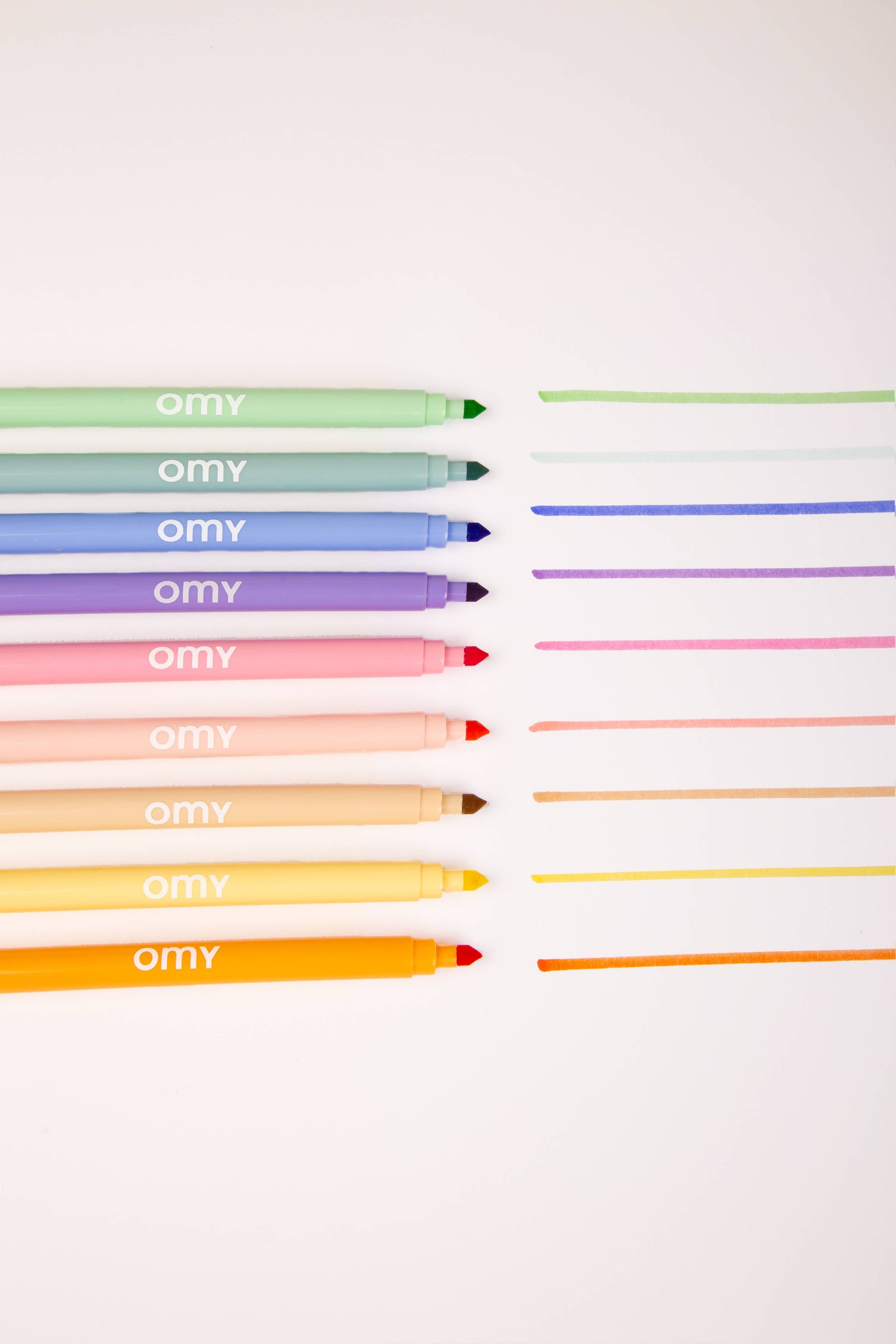 Nine dual-tip pastel markers in a box that doubles as a holder, showcasing soft and vibrant colors for creative coloring and drawing, made in Italy.