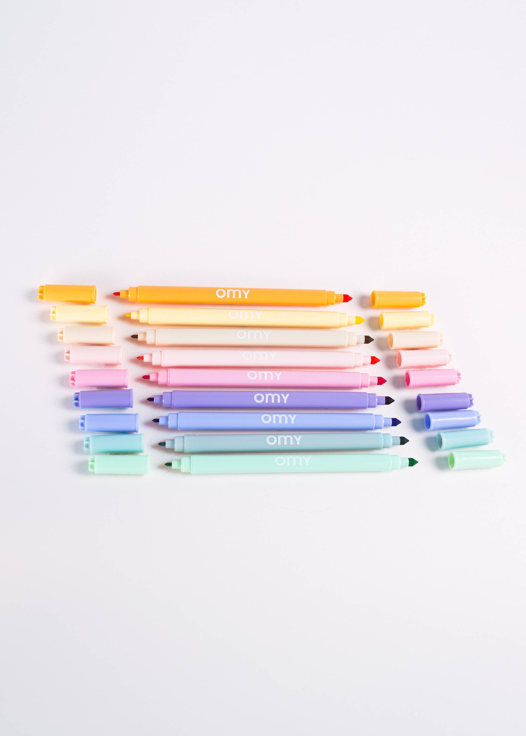 A set of dual-tip pastel markers in a box that doubles as a holder, featuring 9 vibrant colors for creative coloring and drawing, made in Italy.