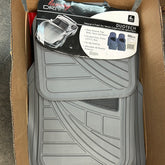 A stack of grey car mats in a box, featuring Duo Tech 4pc all weather black heel pad for auto parts and cars.