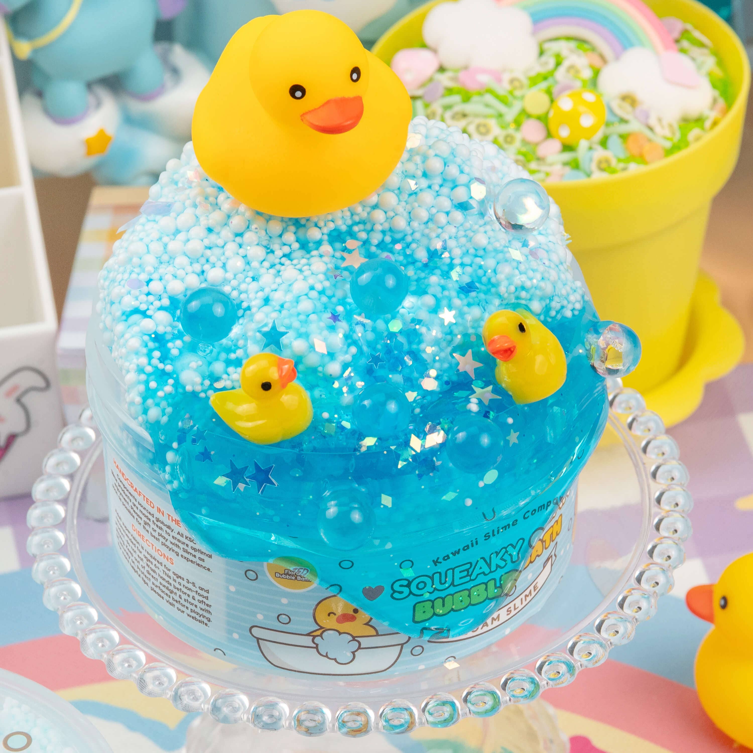 Squeaky Clean Bubble Bath Floam Slime featuring rubber ducks, foam beads, glitter, and a floral scent. Includes a cute squeaky duck toy.