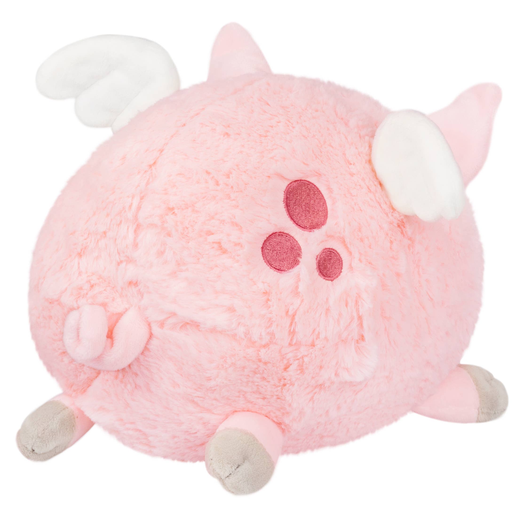 A whimsical Mini Squishable Flying Piglet plush toy with wings, detailed in pink fabric, showcasing a cute piggy bank design. Dimensions: 6.5 x 9.5 x 7 inches. Made of polyester fiber for ages 3 and up.