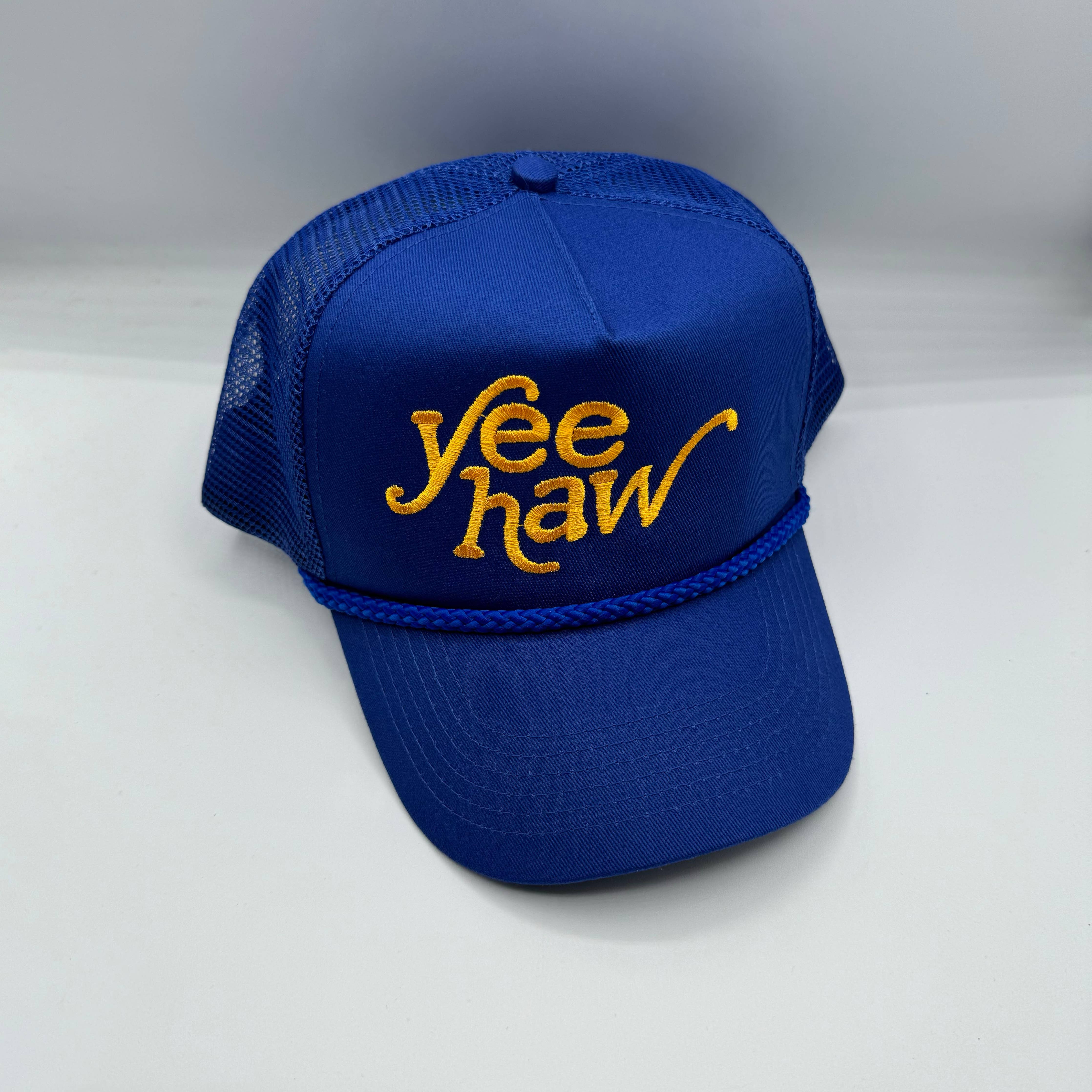 Unisex Yee Haw Trucker Hat with cotton front panel and polyester mesh back. Adjustable one size fits all.