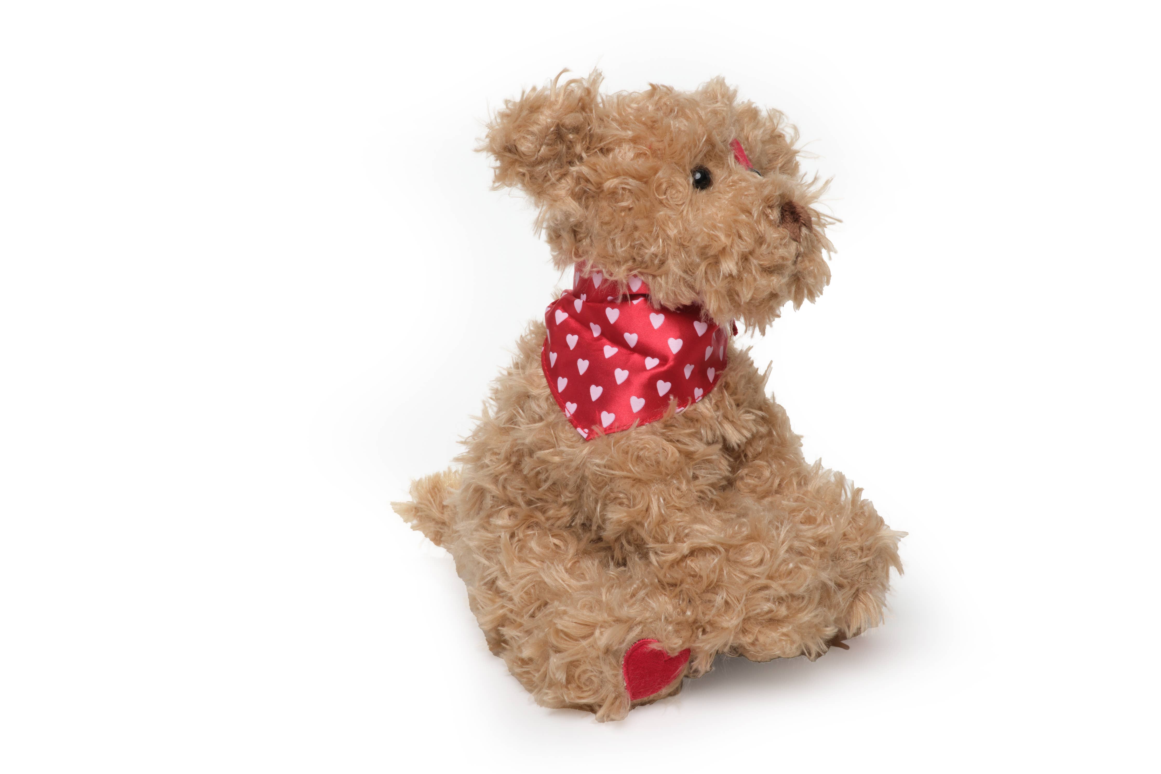 A plush dog named Harry Hugglesmore from the Bearington Collection, 11 inches in size, with a scarf around its neck, invitingly soft and perfect for cuddling.