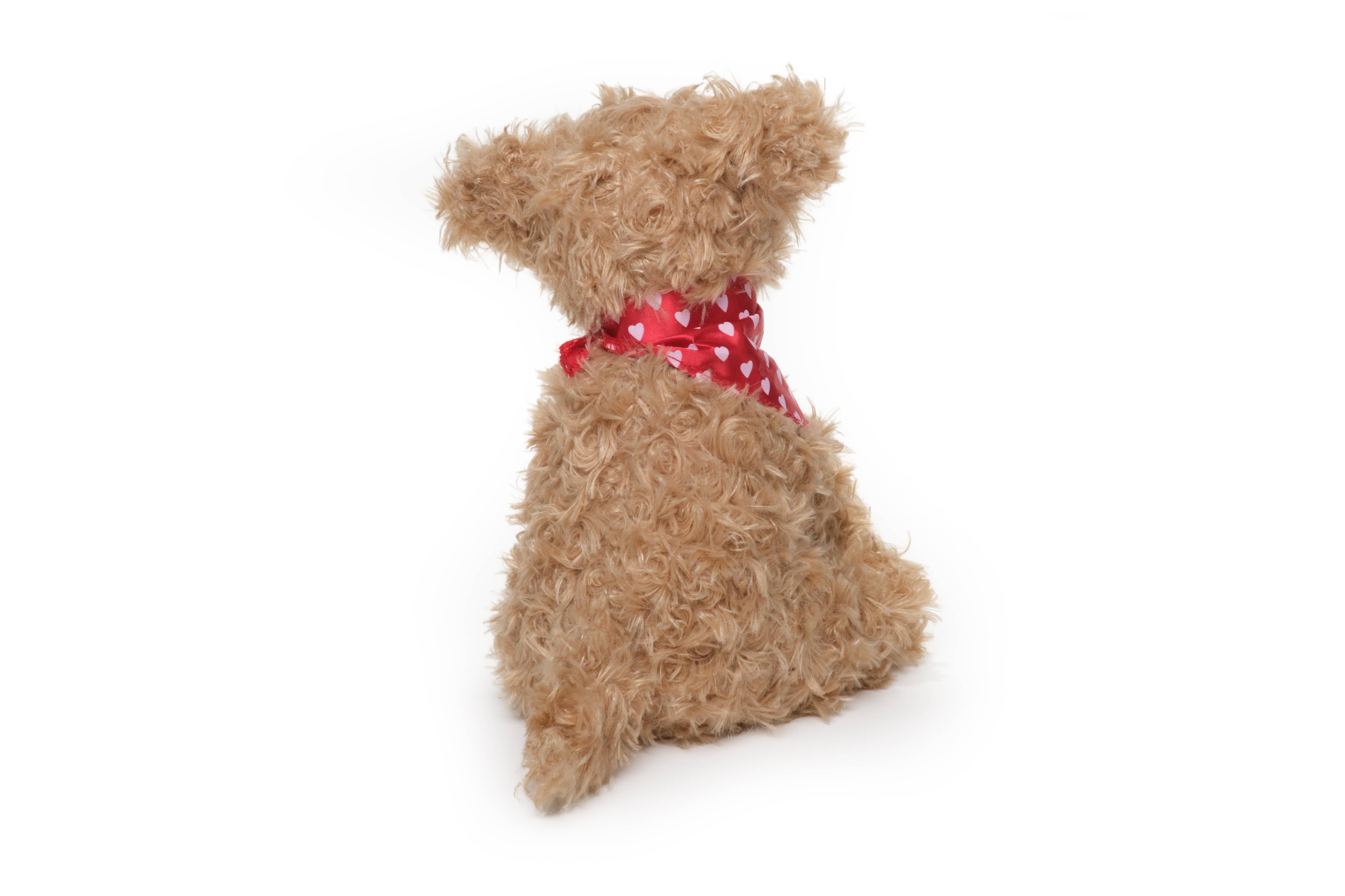 A plush dog named Harry Hugglesmore from the Bearington Collection, featuring a red ribbon and scarf. 11 inches in size, perfect for cuddling with a soft texture and friendly face.