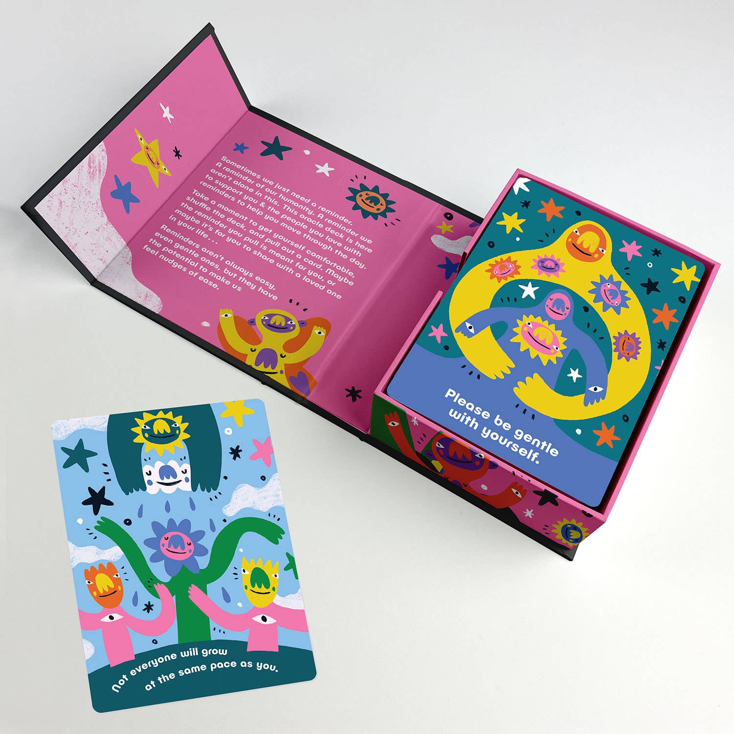 Illustrated self-care oracle deck by Barry Lee, featuring monsters, stars, and whimsical characters on cards in a portfolio-style box with 40 rounded corner cards.