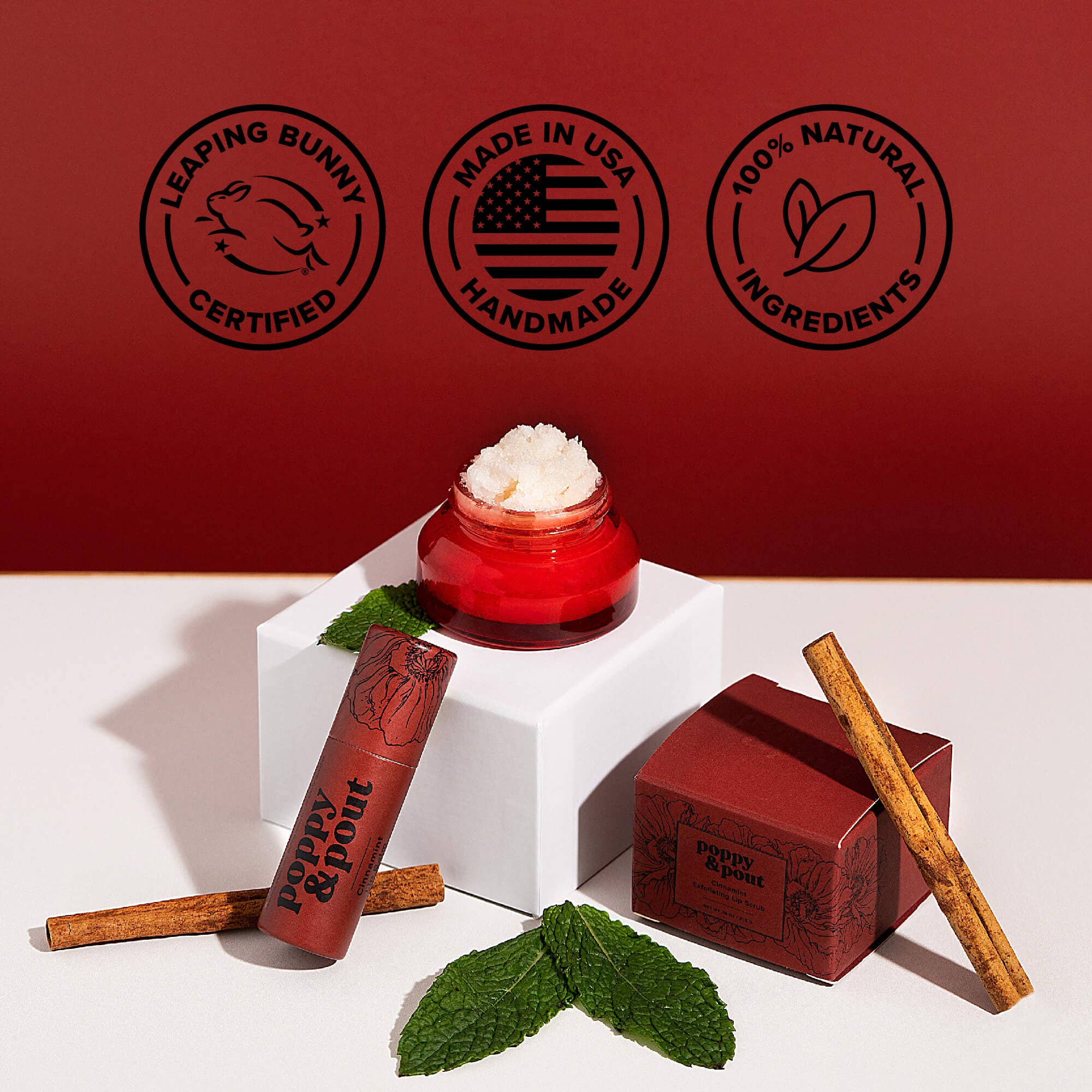 Cinnamint Lip Balm in a jar, with cinnamon sticks, emphasizing natural ingredients, cruelty-free, and double-sized tubes. Handcrafted in Idaho by Poppy & Pout.