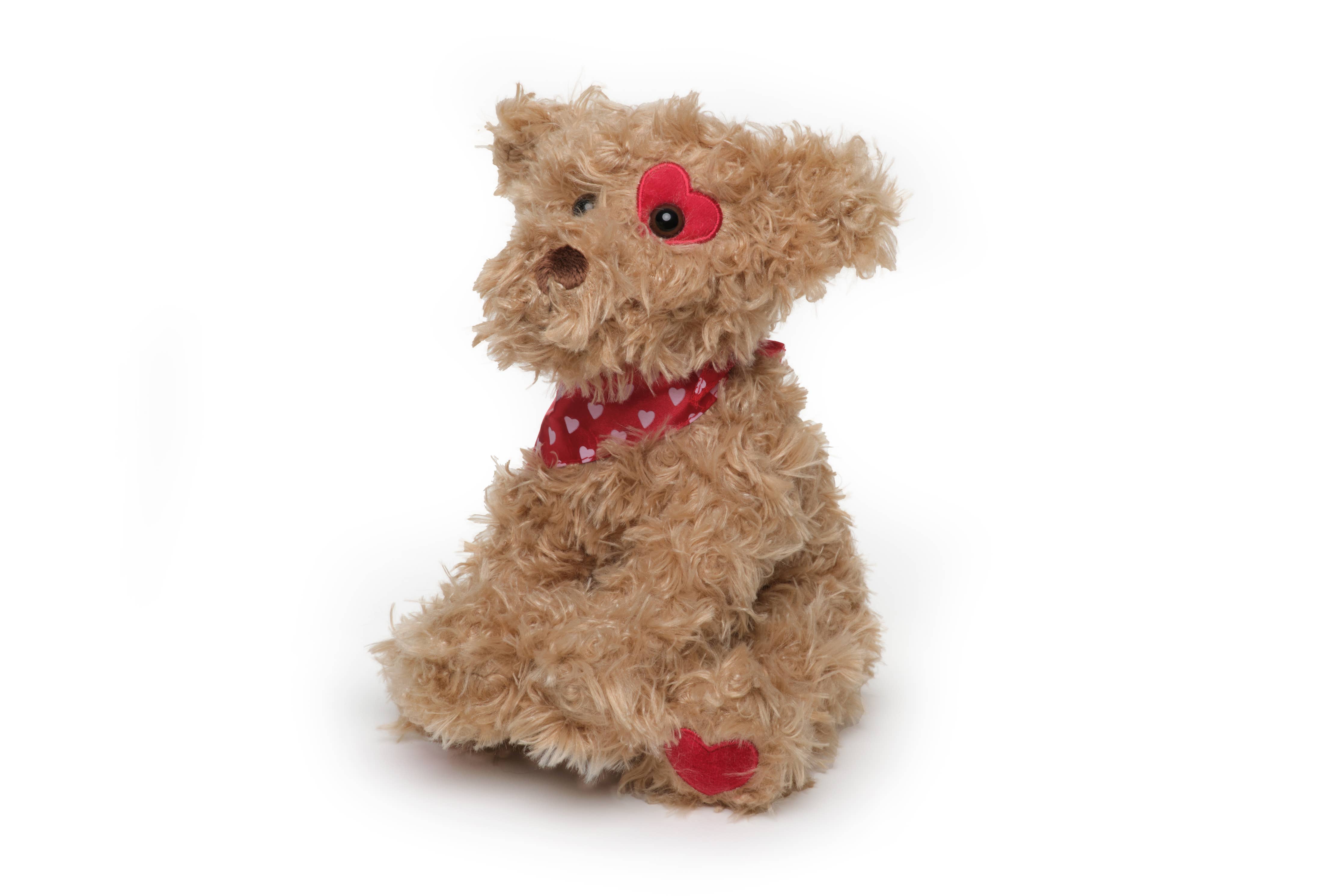 A close-up of Harry Hugglesmore, a plush dog from Bearington Collection, featuring a heart on its head. Soft, cuddly, and perfect for little hands.