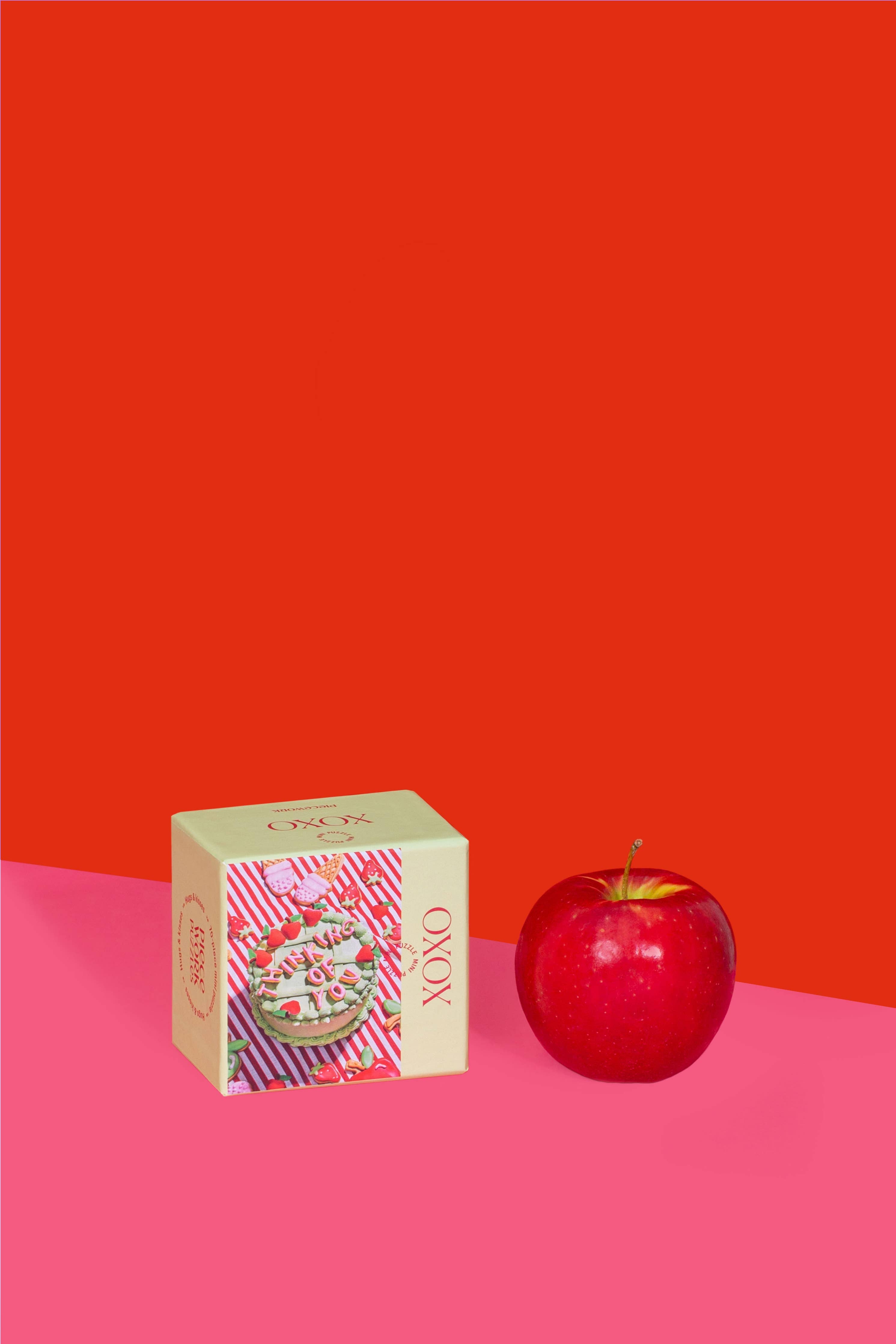 XOXO Mini Puzzle box with apple and cake imagery, perfect for gifting warm wishes. Measures 3.5 x 2.5 x 2.75 inches, featuring high-quality art paper and recycled board.