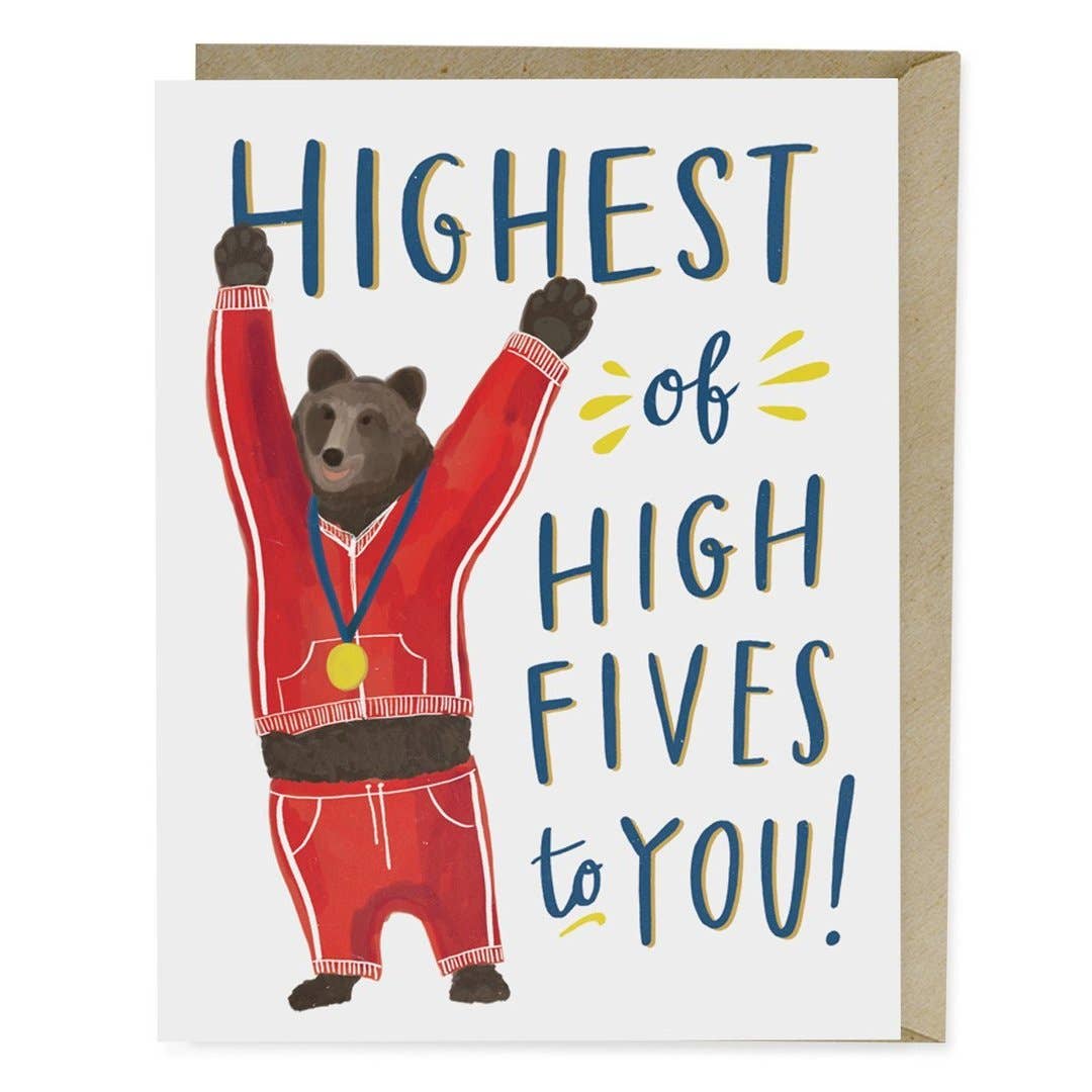 A card featuring a bear in a red suit with a medal, embodying a congratulatory gesture. Blank inside, A2 size, printed in the USA on matte stock, with a kraft envelope.