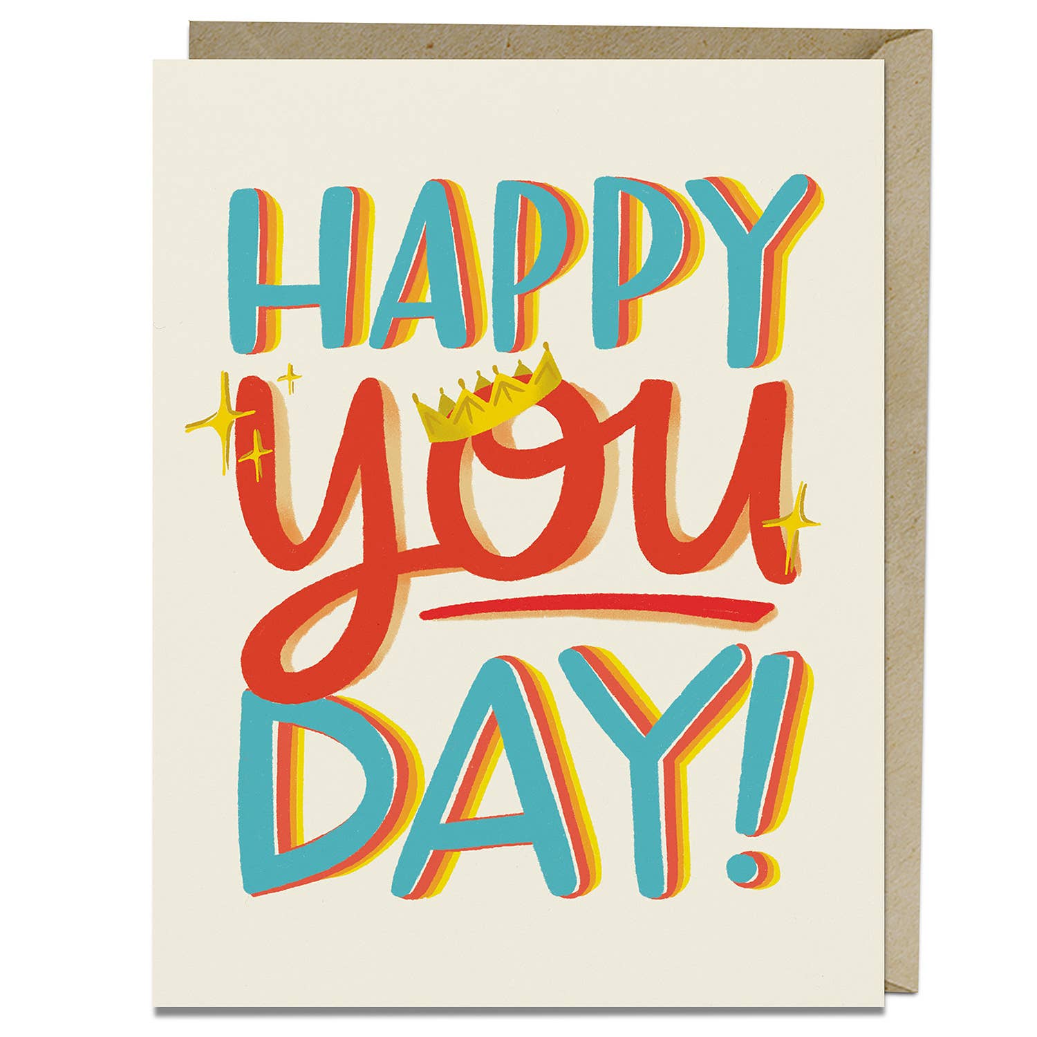 Illustrated Happy You Day Birthday Card featuring a colorful text with a crown design. Blank inside, A2 size, printed in the USA on matte stock. Comes with a kraft envelope. By Kari Chapin and Emily McDowell.