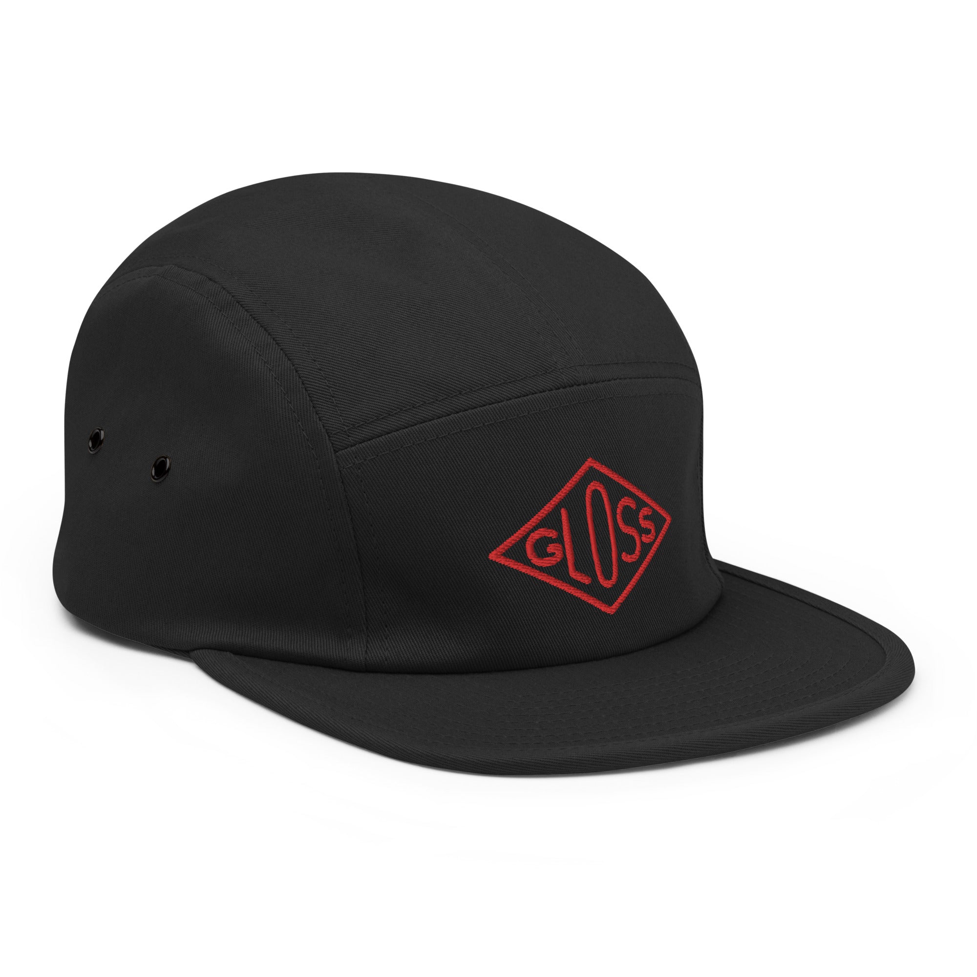 A classic Five Panel Cap in black with a red logo. Made of 100% cotton, soft-structured, with metal eyelets and a nylon strap clip closure.