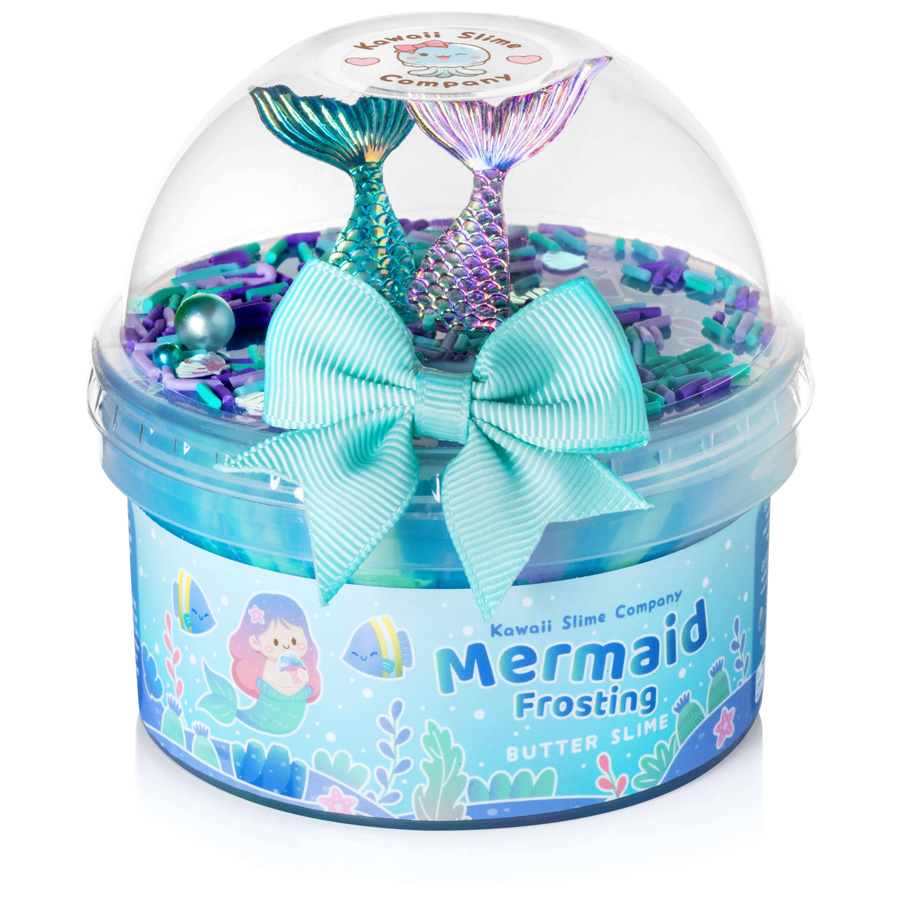 Colorful container of butter slime named "Mermaid Frosting Butter Slime (4pcs/case)" by Kawaii Slime Company, adorned with blue and purple sea-themed decorations, small mermaid tails, and topped with a bow. The design includes a mermaid illustration and underwater elements on the packaging, featuring magical mermaid toppings.