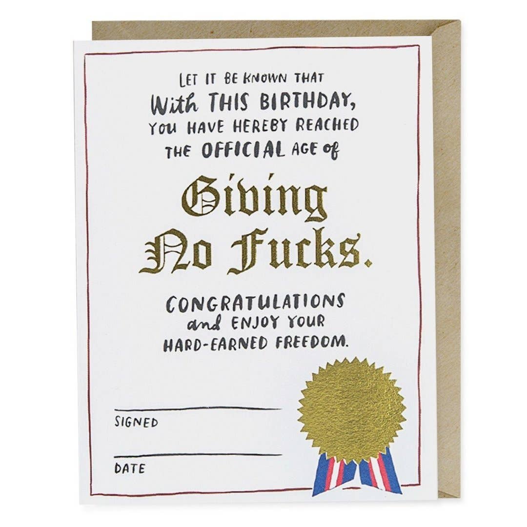 Em & Friends - Decree Birthday Foil Card: A card with a gold seal, ribbon, and text. Blank inside, A2 size, printed in the USA on matte stock, with a kraft envelope.