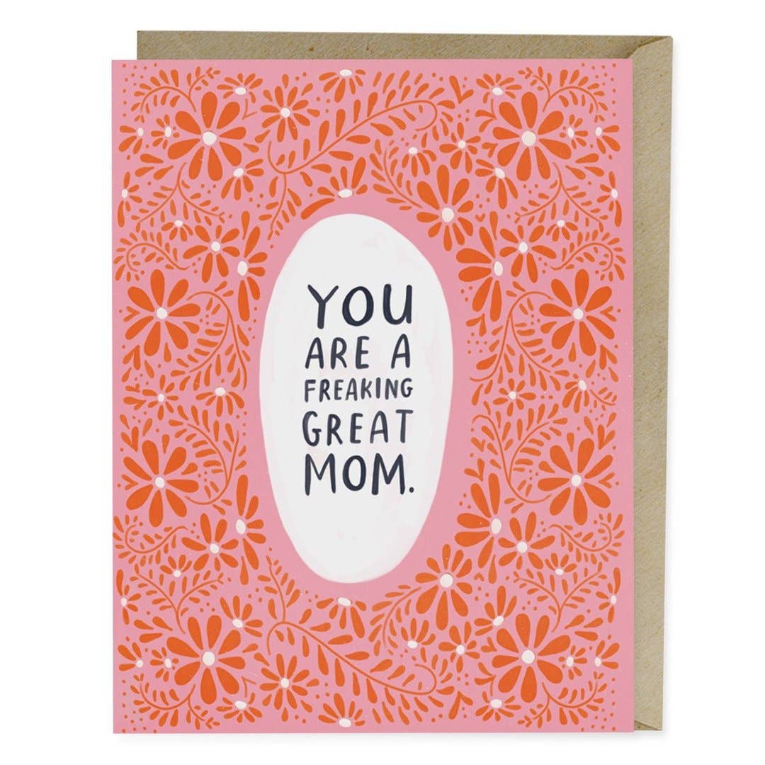 Em & Friends - Freaking Great Mom Mother's Card featuring a pink card with flowers, a white oval, and black text. Blank inside, A2 size, printed in the USA on matte stock, with a kraft envelope.