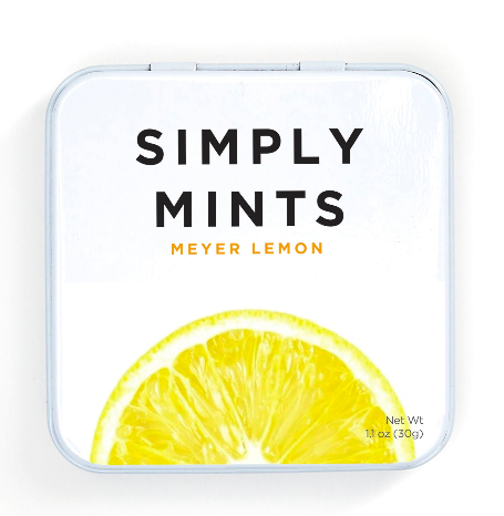 Meyer Lemon Mints in white tin box with lemon slice on top, close-up of lemon slice, and black letters. 6 tins x 45 mints each, no artificial sweeteners.