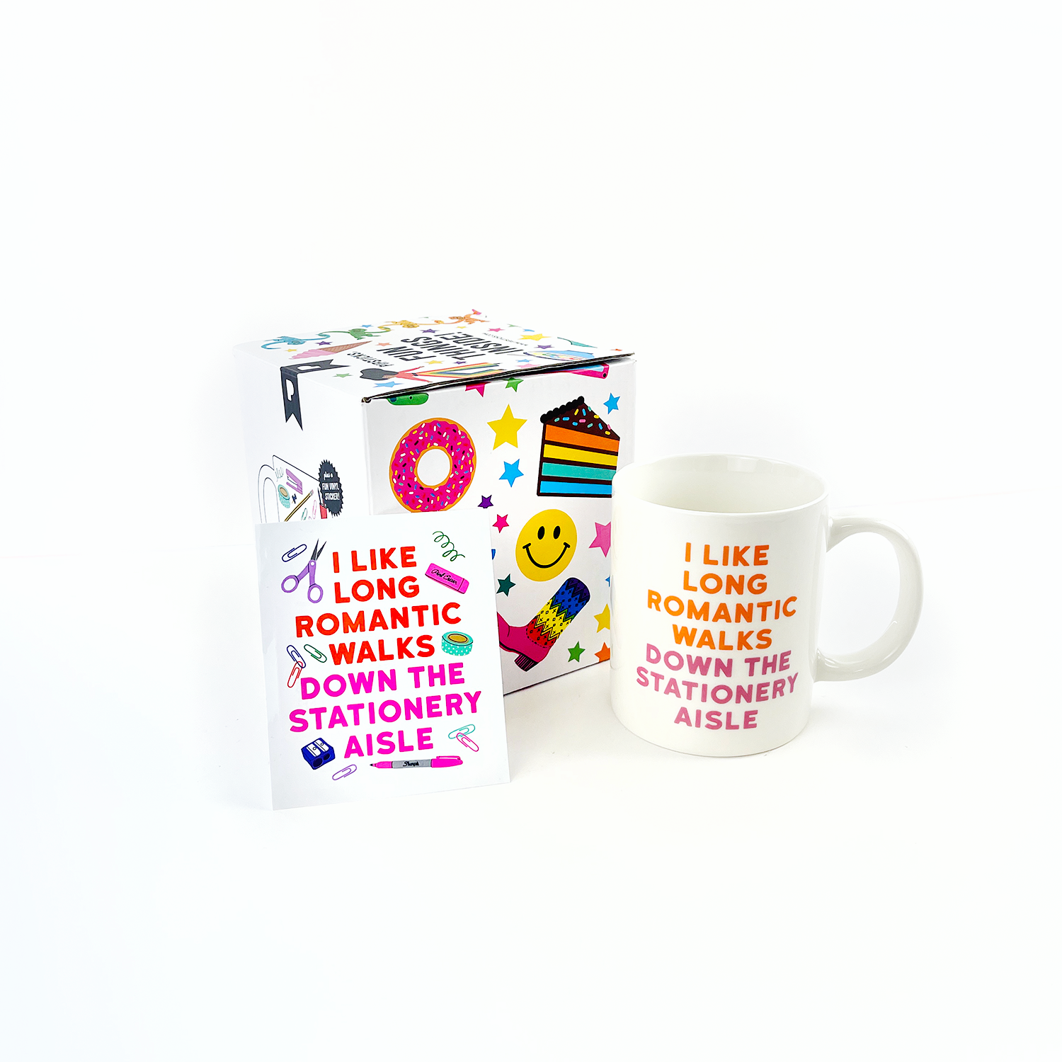 A white mug featuring vibrant sticker-themed designs, accompanied by a box with a book and note. Perfect for sticker enthusiasts, microwave and dishwasher safe, 11oz capacity. Includes Pipsticks Stationery Aisle mug and matching vinyl sticker.