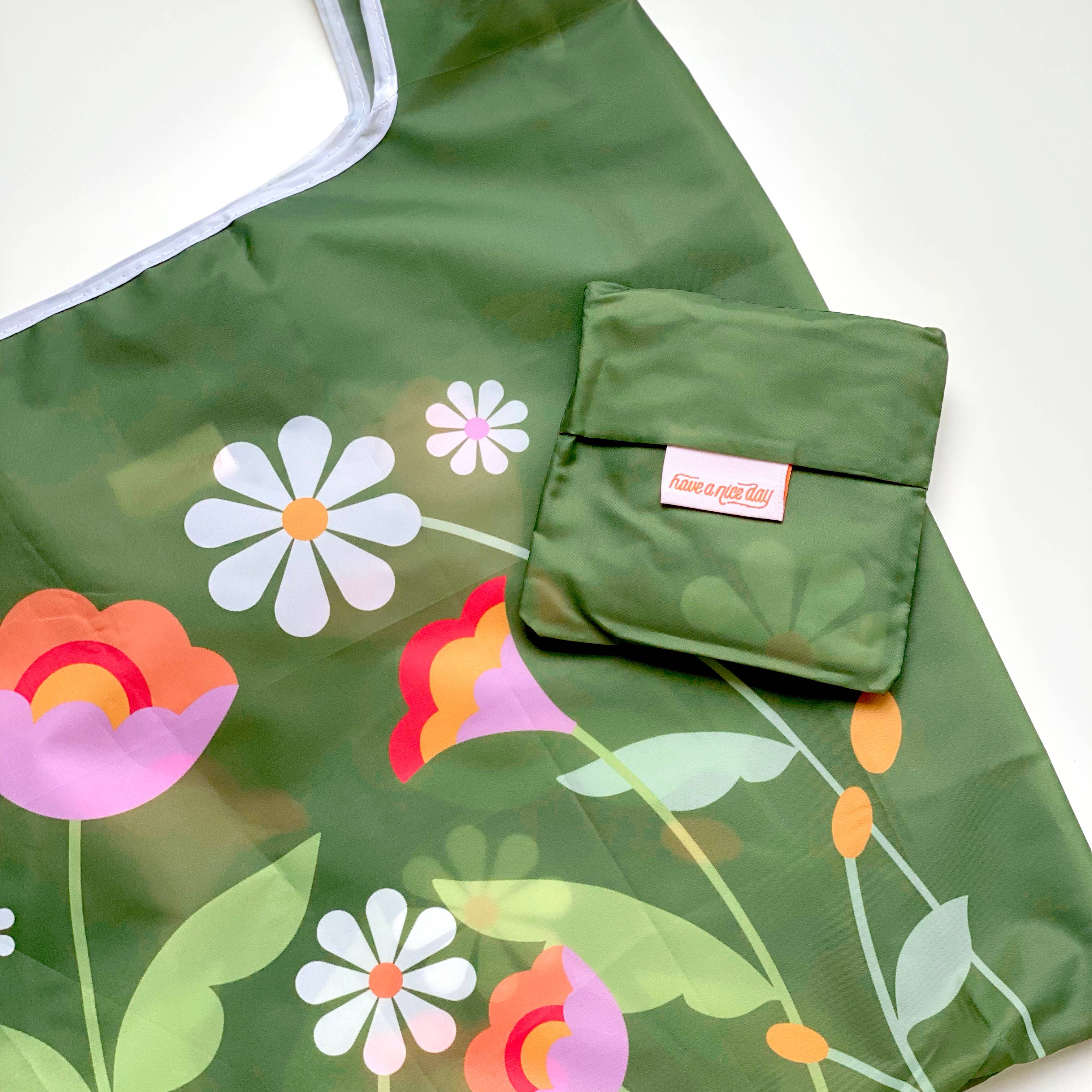 Dannielle Reusable Nylon Bag featuring green floral design, folds into pocket, 25 x 14 x 5.