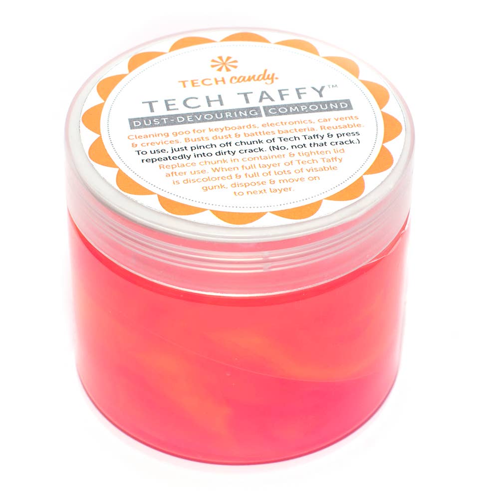 Tech Taffy dust-devouring compound in red and white container with pink liquid, featuring a round white and orange label. Ideal for cleaning keyboards, electronics, and car vents.