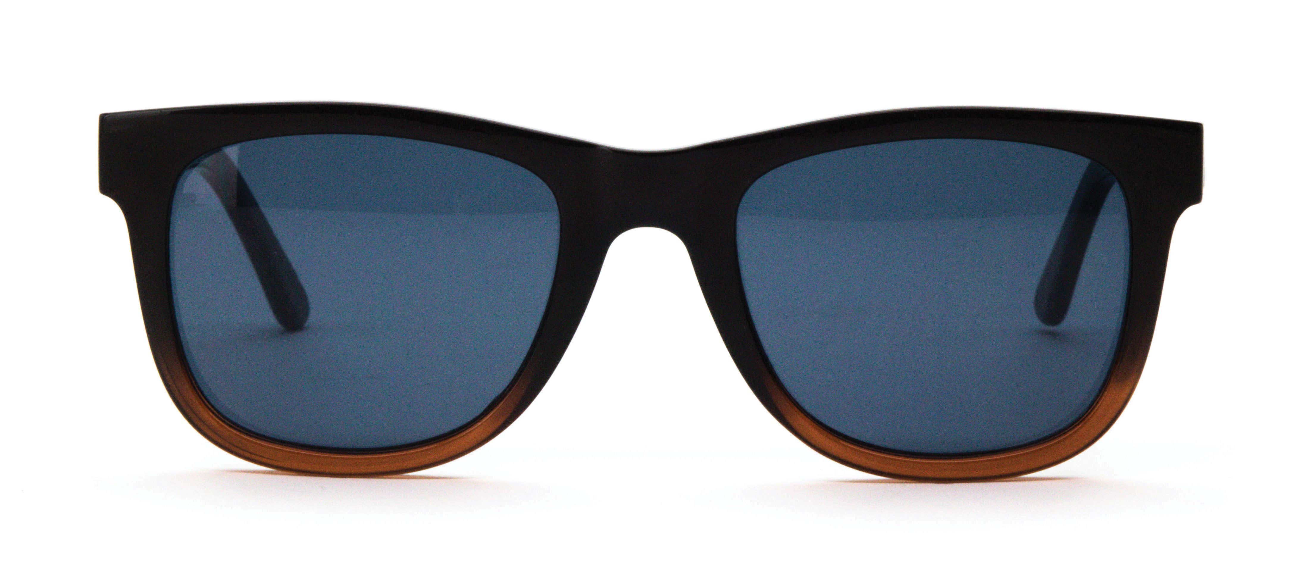 Optimum Optical Sunglasses Open Stock: A variety of sunglasses with blue lenses, individually boxed, featuring UV protection and a patterned microfiber cleaning case. 