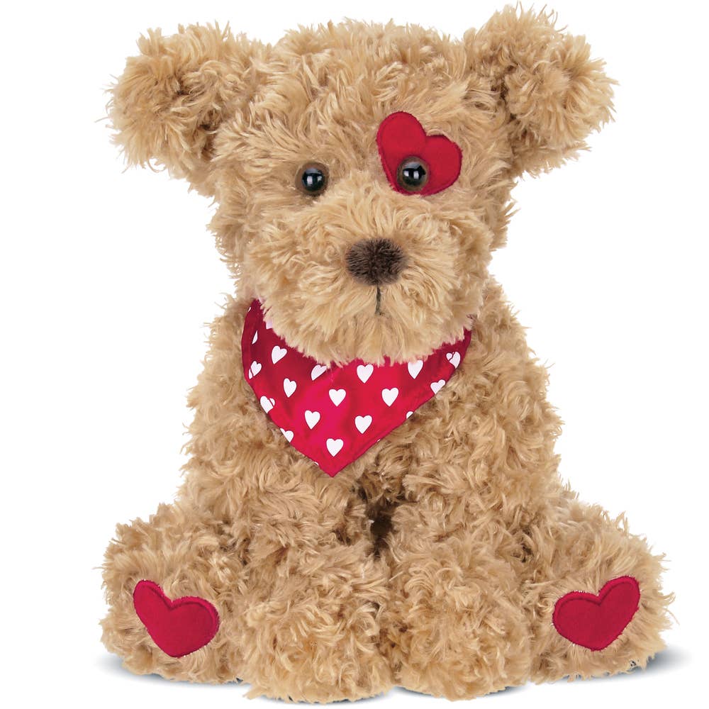 A plush dog from the Bearington Collection, Harry Hugglesmore, a cuddly 11-inch toy with a bandana, soft texture, and friendly face, perfect for little hands.