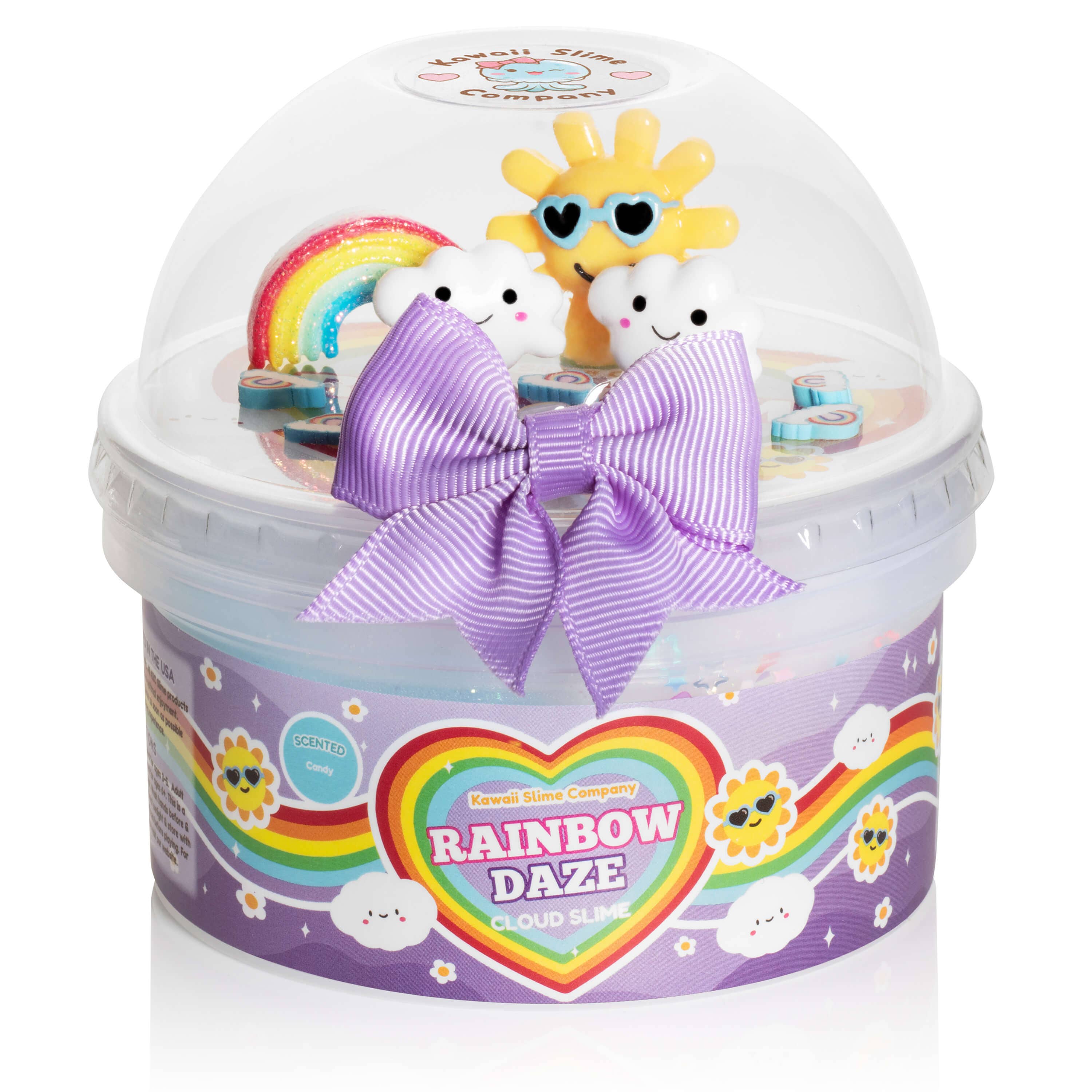 Rainbow Daze Cloud Slime: A plastic container with a purple bow, clouds, and a rainbow. Kawaii charms and a soft, fuzzy cloud texture for a sensory adventure.